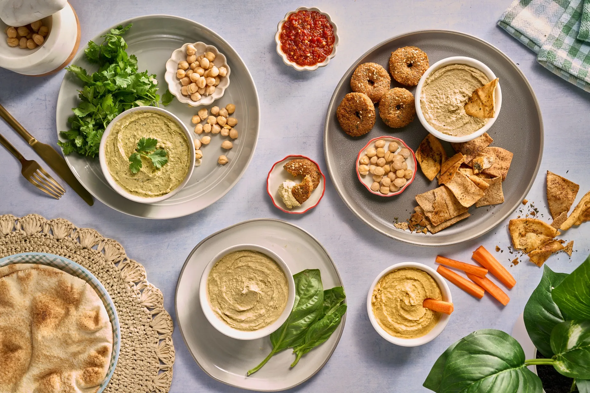 Golden falafel served with creamy hummus, tahini, pickled turnips, and warm pita