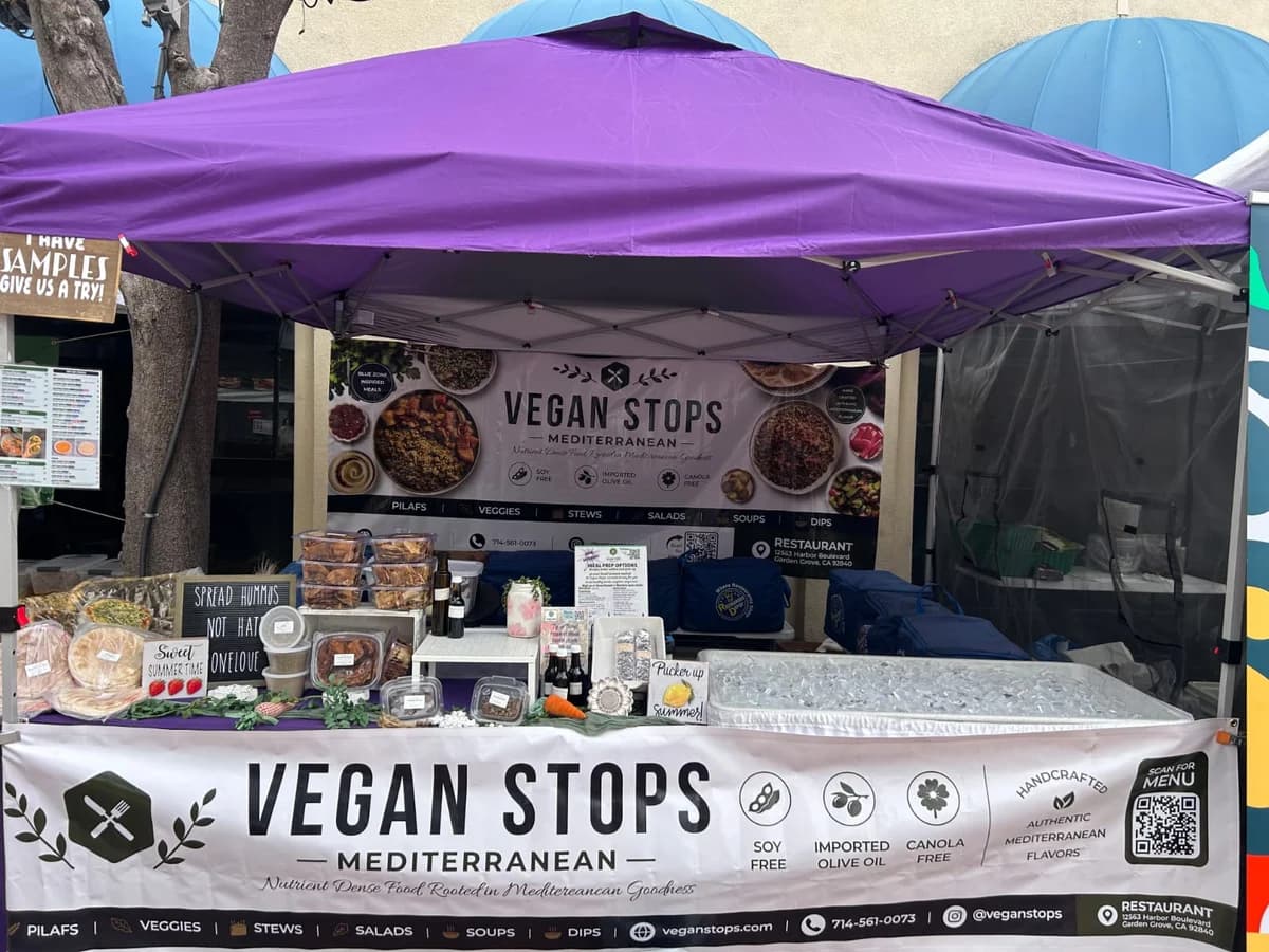 Vegan Stops farmers market booth setup